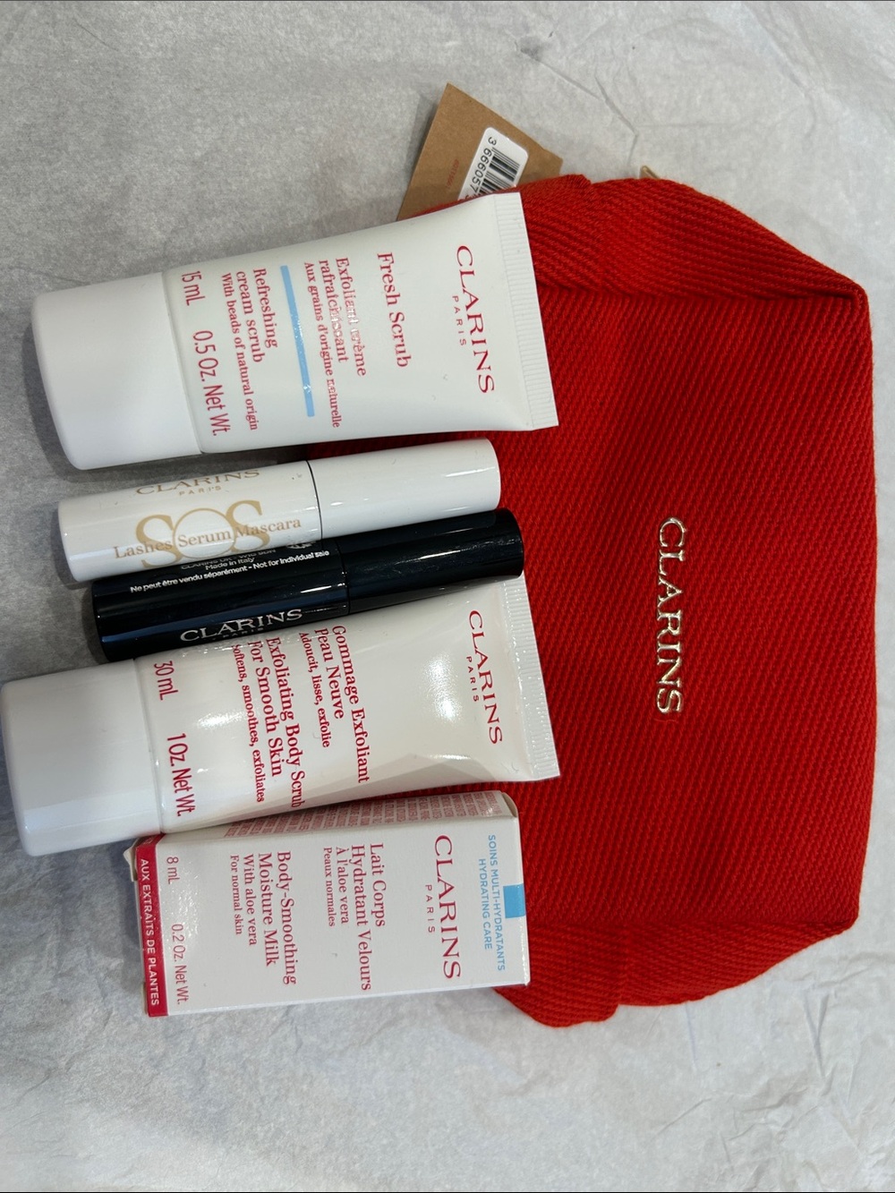 Clarins Makeup Set with Red Cosmetic Pouch and Black Mascara